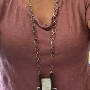 Handcrafted Noonday necklace of bone and silver metal